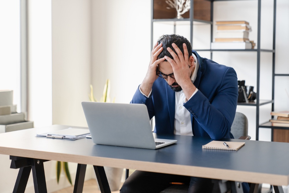 Continuing Business Education, A person with their head in their hands