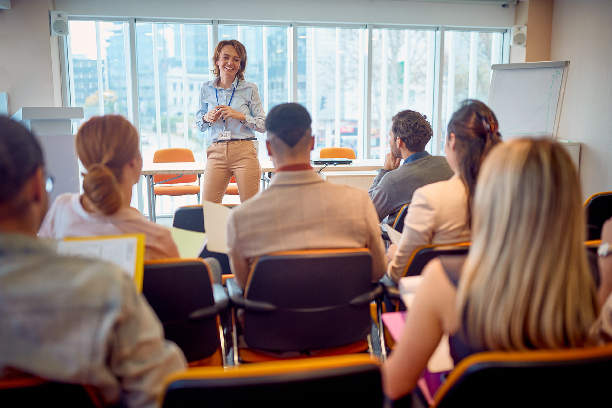 Employees participating in a workplace training session led by an instructor.